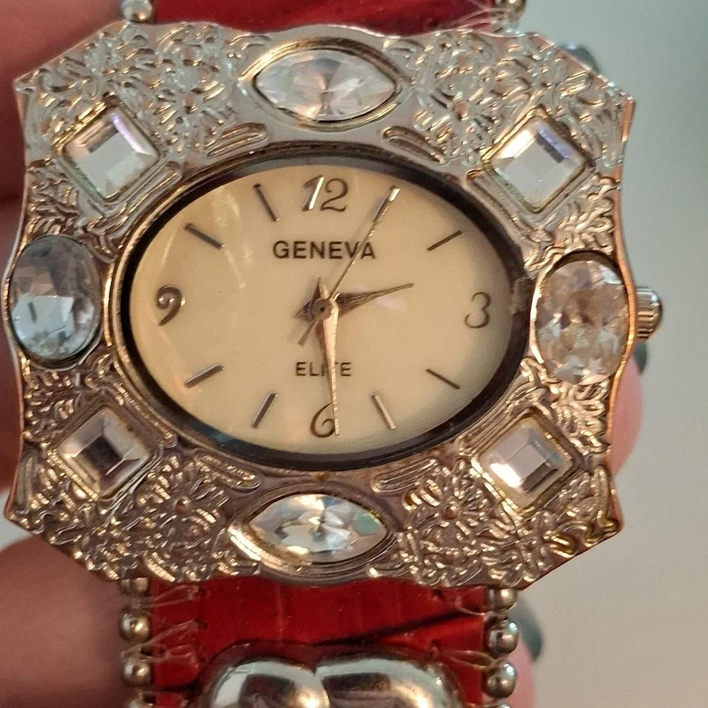 Geneva 92643 Womens Buckle Watch. Red Band, Silvertone,Elephant & Gem Accents.